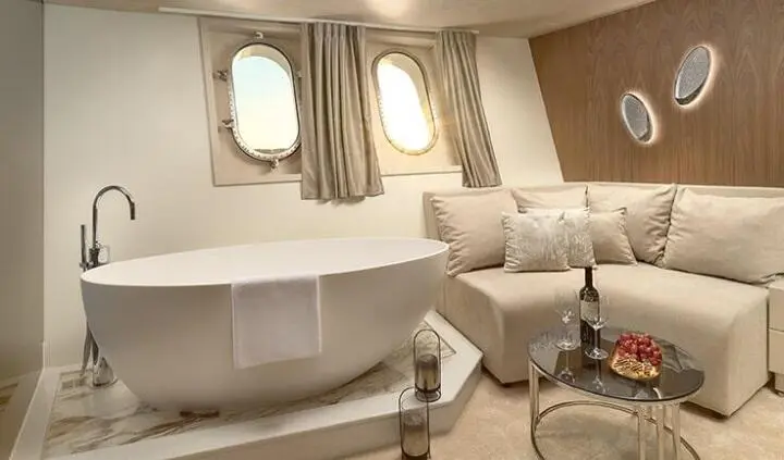 Cristal yacht master cabin with king bed, ensuite, porthole windows, curtains