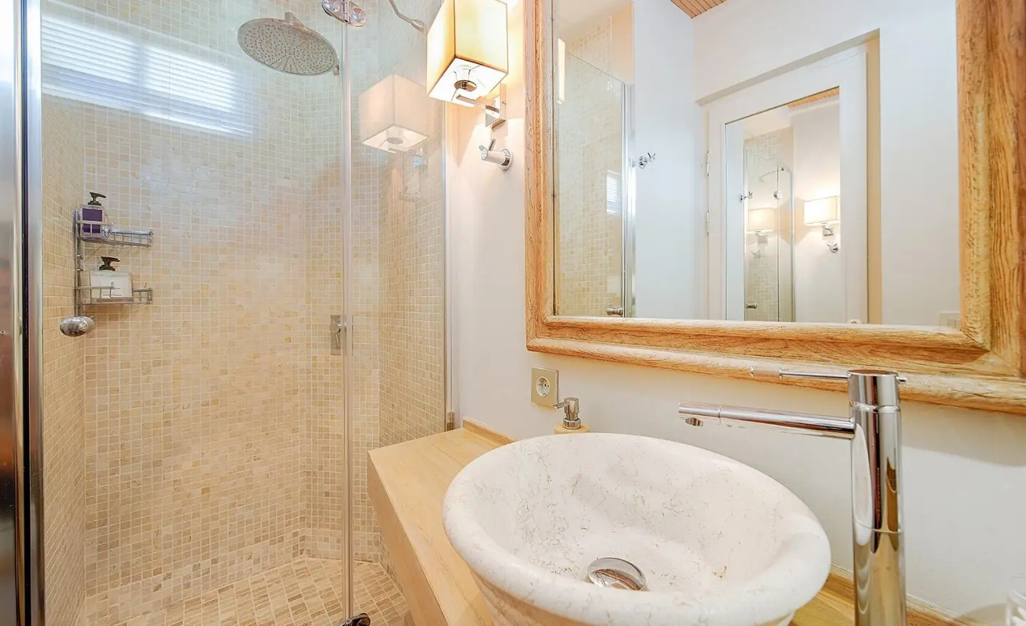 Cobra King yacht interior bathroom with sink and mirror, warm lighting