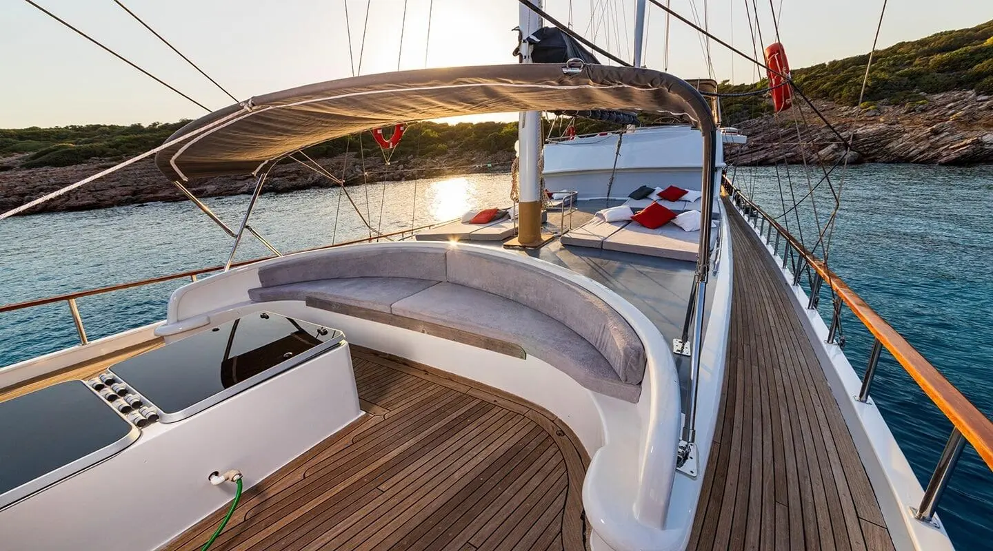 Sunlit Bodrum Queen yacht deck with curved seating area