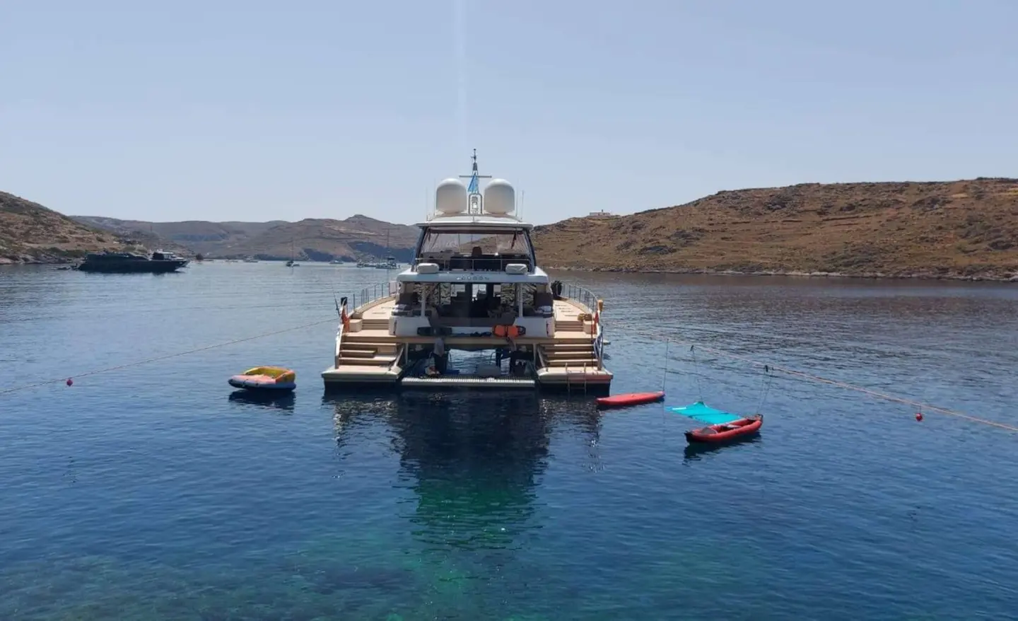 Just Marie 2 yacht anchored in calm blue bay with small boats nearby