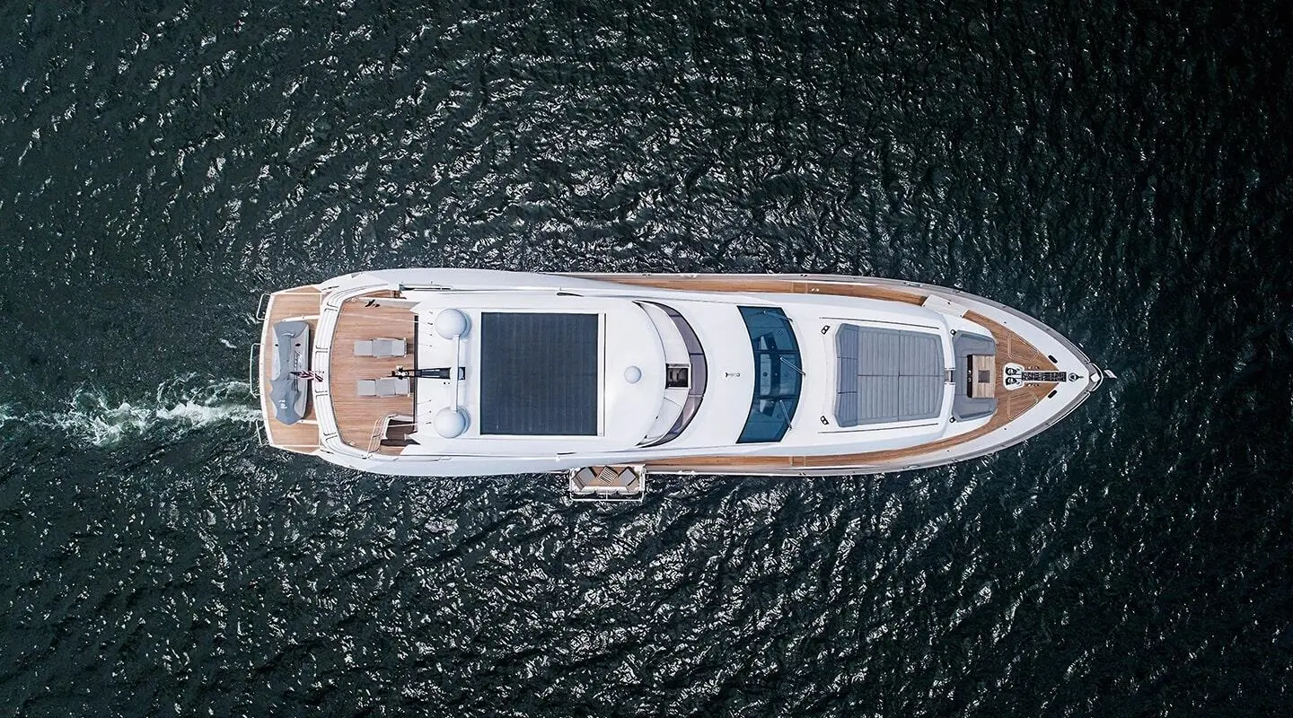 Top-down view of Quantum yacht, white hulls, dark water surrounding