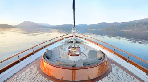 Bow deck of Cobra King yacht with polished wood surface and lifebuoy rings