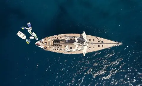 Aizu luxury yacht seen from above sailing on deep blue water, center framing