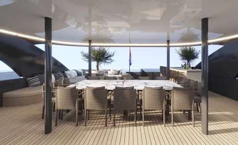 Bello luxury yacht outdoor deck with bar seating and expansive sunset view