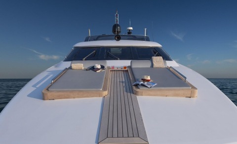 Project Steel on a sunlit bow with lounge pads, wooden decking, and sea horizon