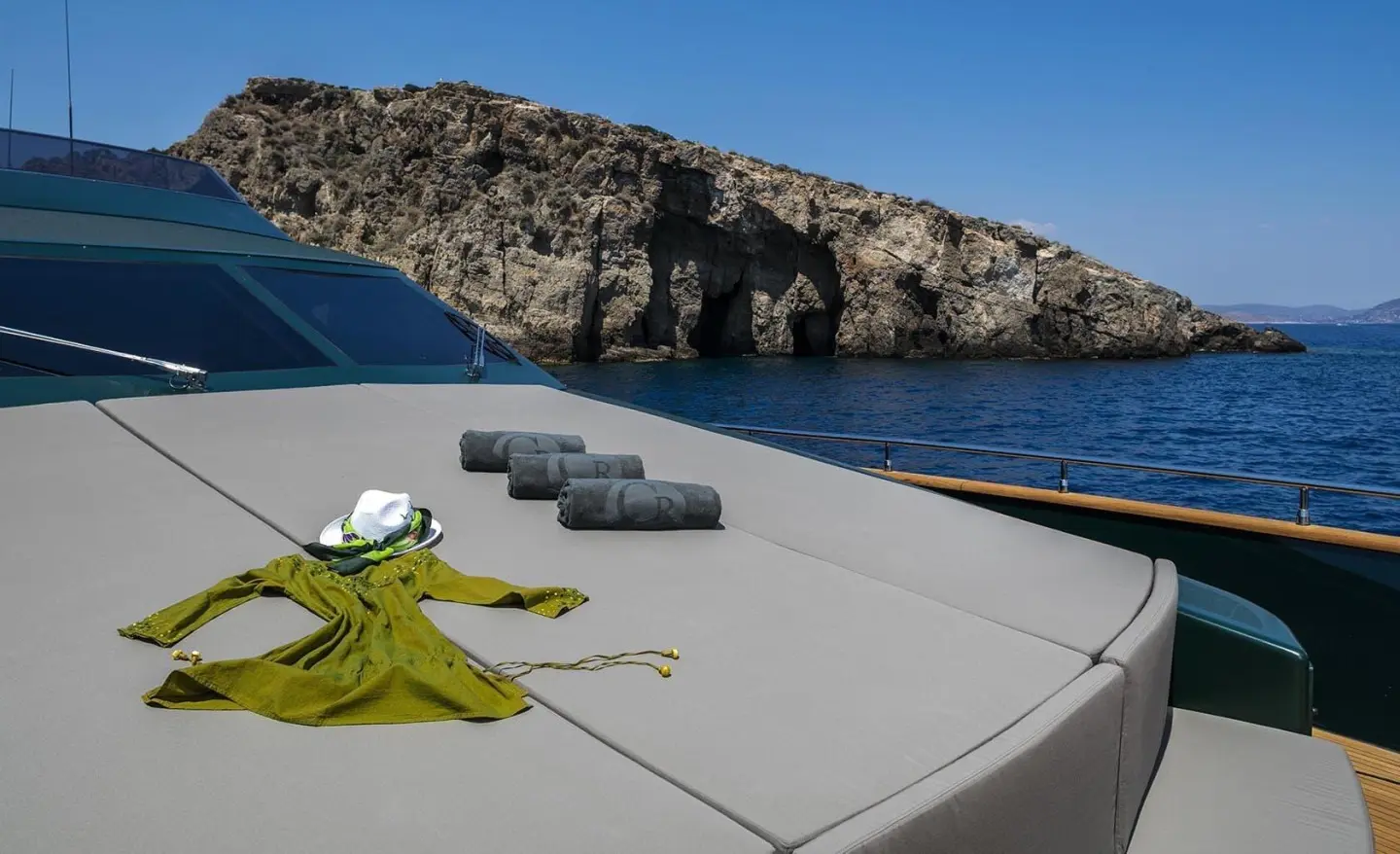 Bow deck of a yacht with mooring lines and a cleat in view