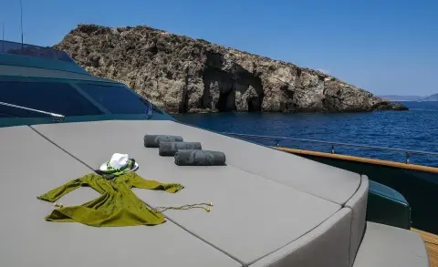 Bow deck of a yacht with mooring lines and a cleat in view