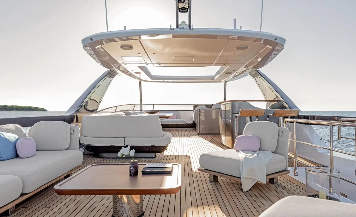 Viva II yacht on the open deck with seating area and table in bright light