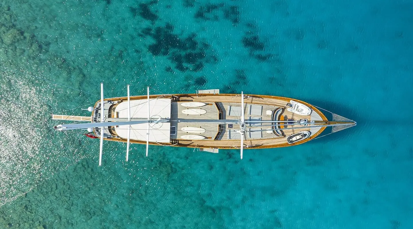 Aerial view of gulet Bedia Sultan anchored in turquoise sea