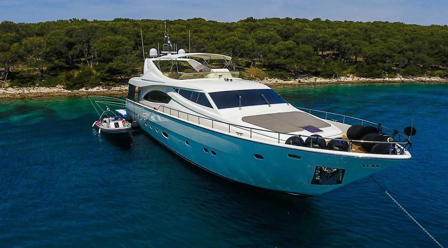 Miss Katariina luxury yacht anchored in turquoise water near rocky coast