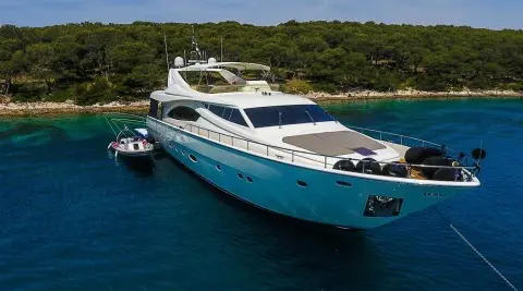 Miss Katariina luxury yacht anchored in turquoise water near rocky coast