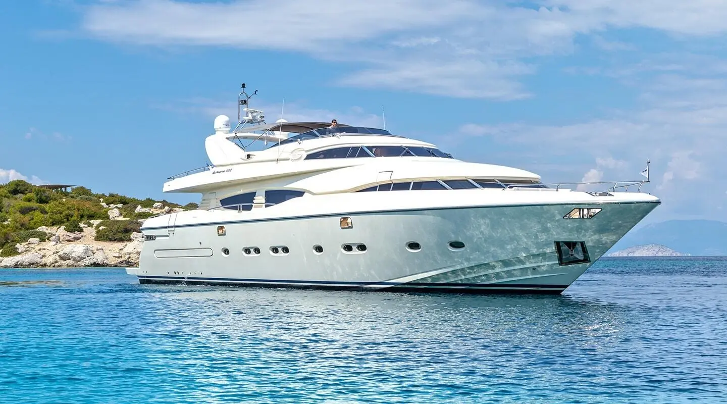 Divine luxury yacht anchored in clear blue water, side view, sunny sky