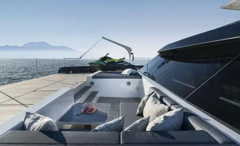 Alteya yacht aft deck with seating, table, and watercraft on swim platform