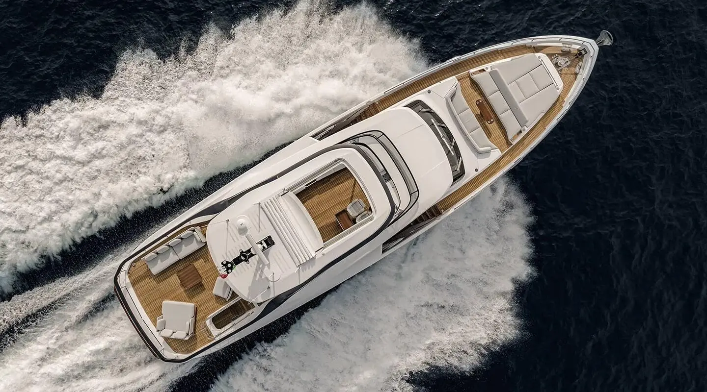 Top-down view of Viva II motor yacht cruising through blue water, bow forward
