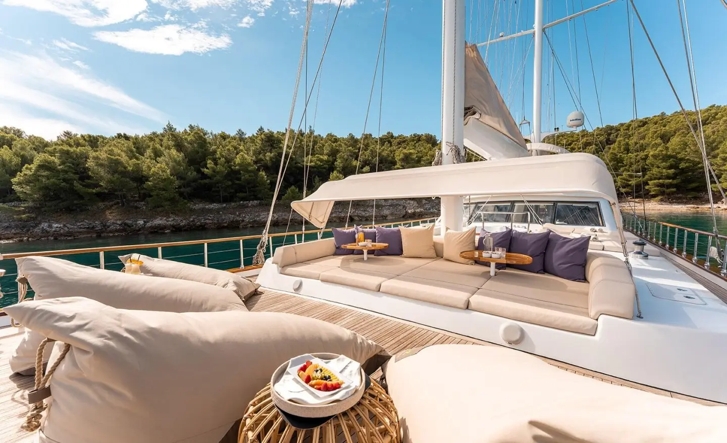 Alessandro I luxury gulet at sunset with deck seating and rigging