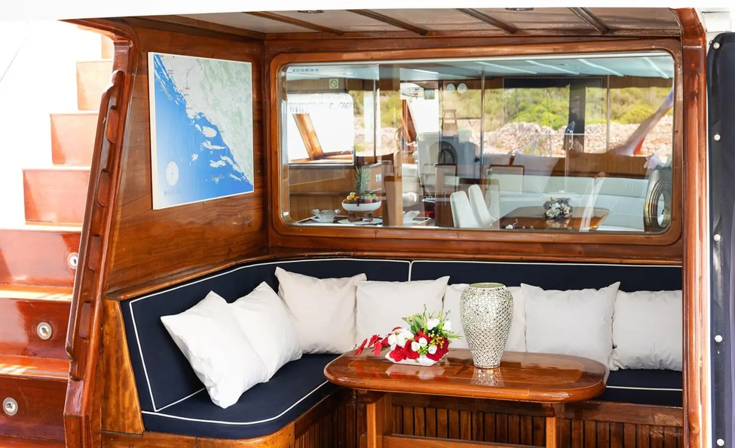 Aurum gulet aft deck with wooden seating and table
