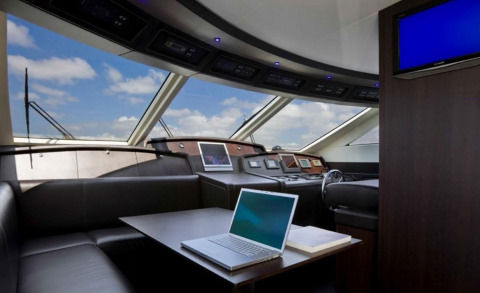 Miraval motor yacht saloon with conference table and laptops