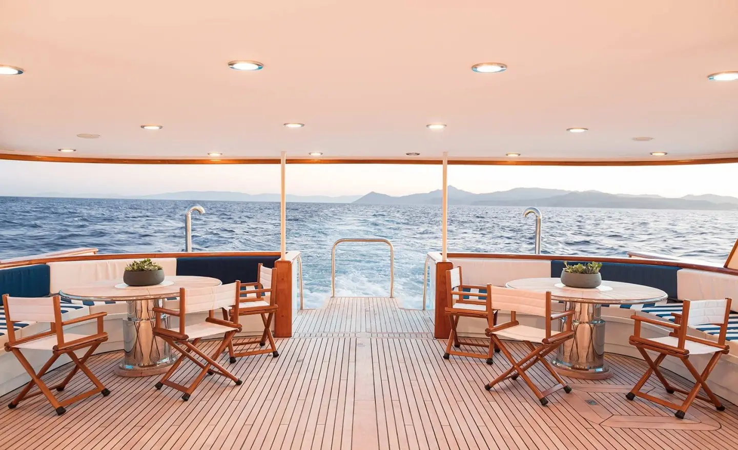 Wind Of Fortune aft-deck with seating, wooden deck, railings, ocean view