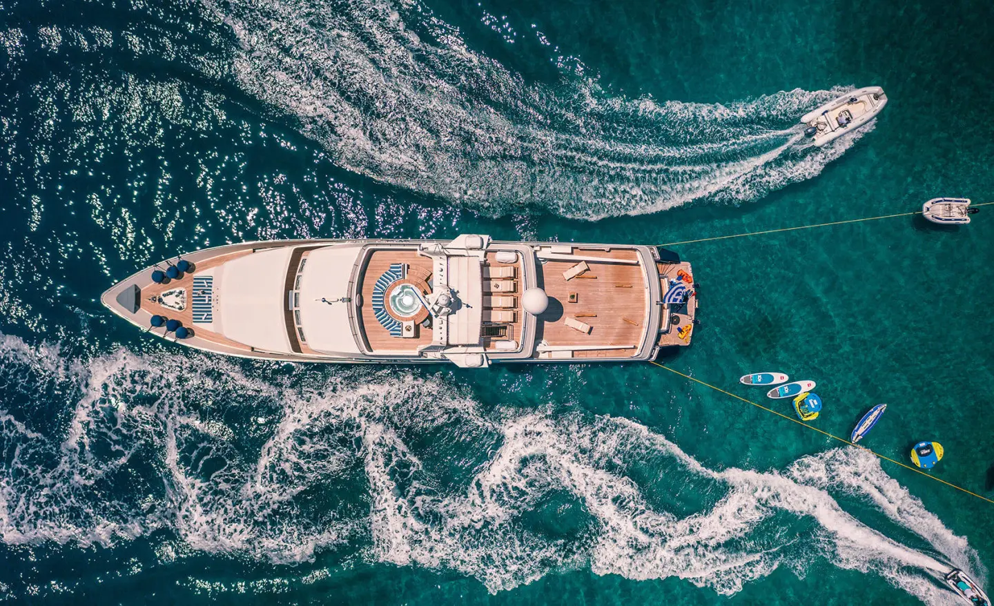 Aerial view of Magix motor yacht cruising through clear blue water