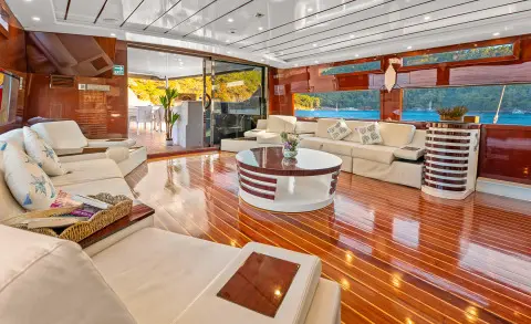 Esma Sultan luxury yacht interior with polished wooden deck and seating area