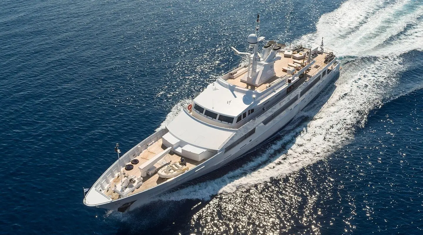 Aerial view of a sleek motor yacht named O'Natalina cruising on blue sea