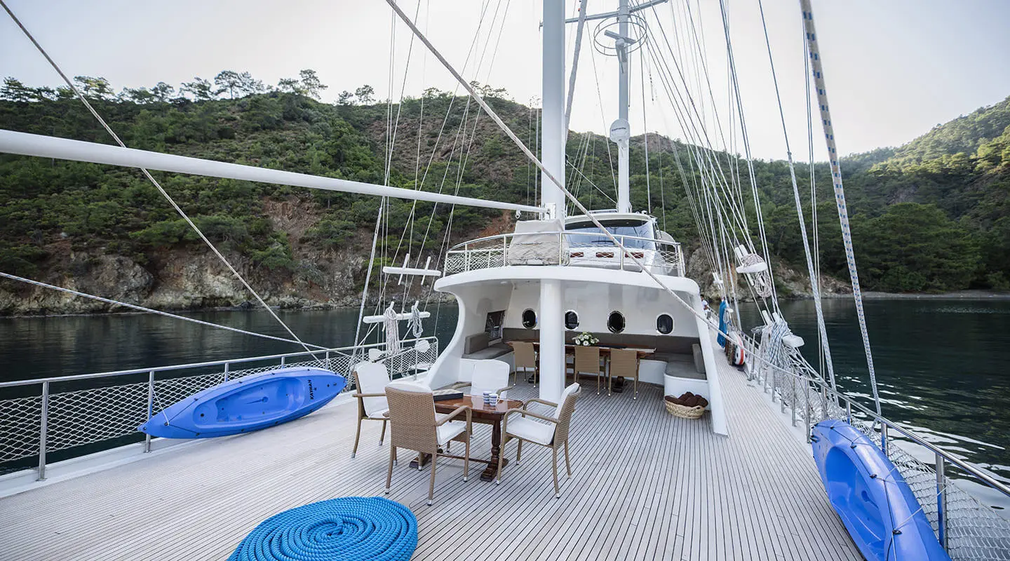 Kayhan 4 yacht helm area on deck with seating and sunset glow