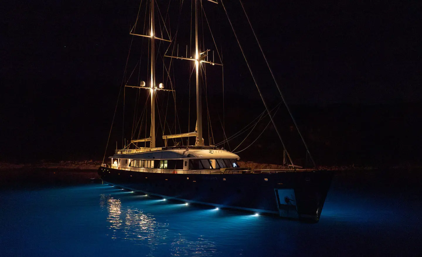 Nocturno yacht at night illuminated on the water