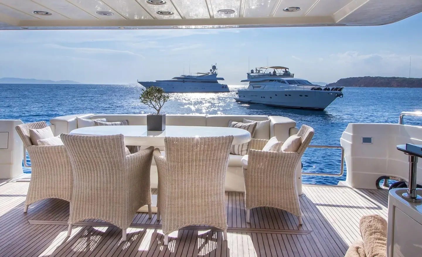 Amoraki luxury yacht with seating area on deck overlooking blue sea