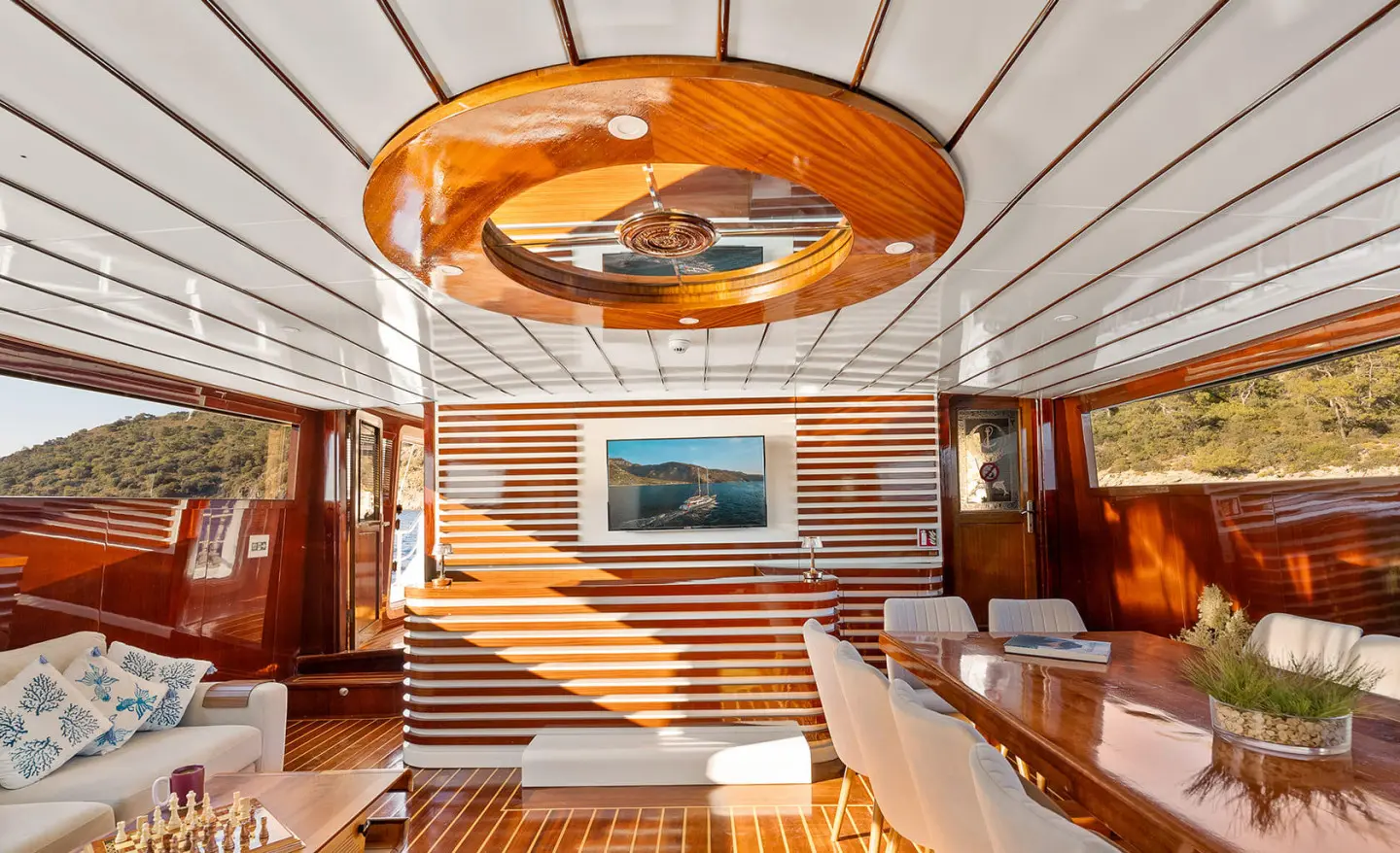 Interior of Esma Sultan yacht with wooden panels and seating area