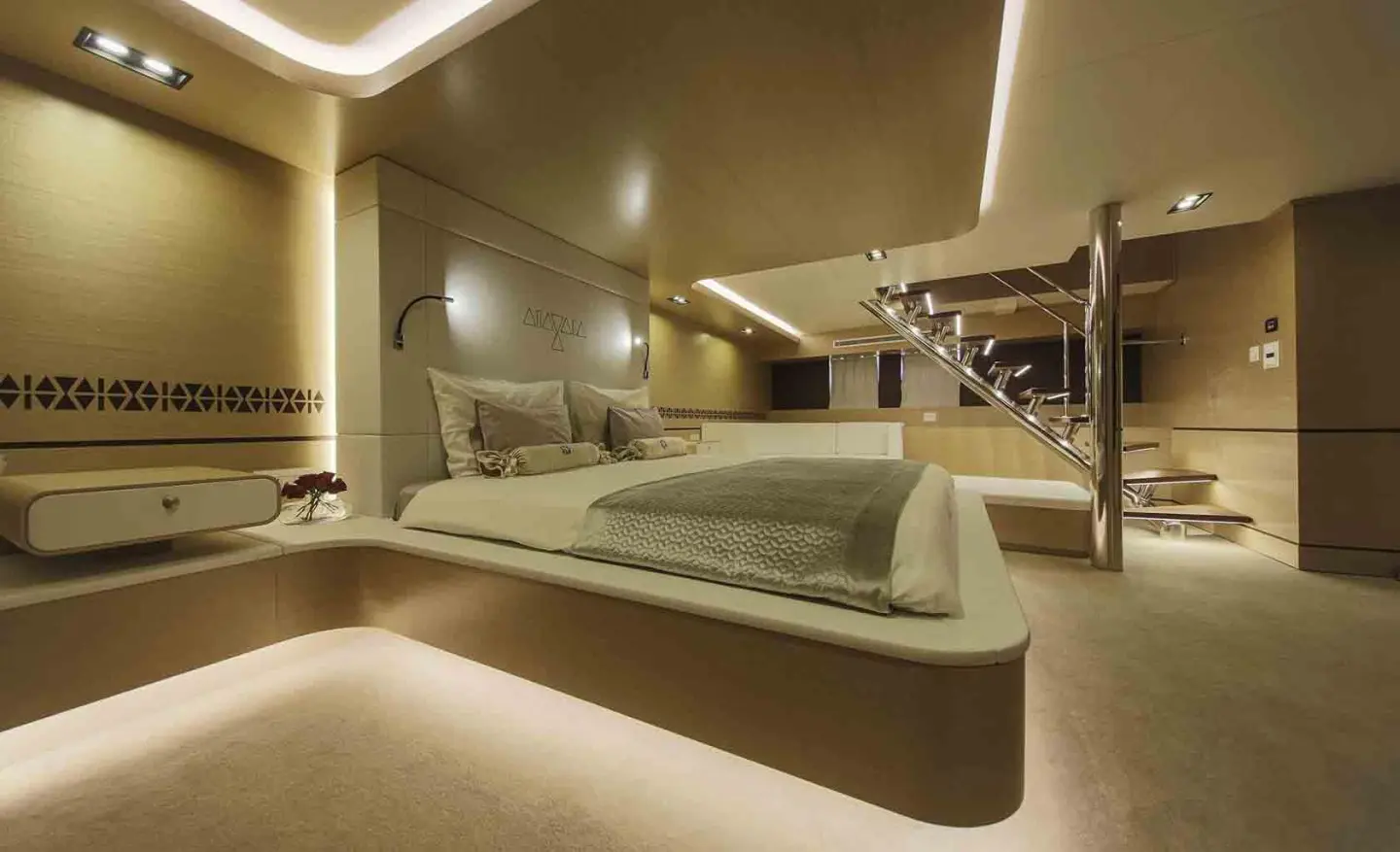 Omnia yacht exterior: sleek white hull, deck lounge, and sunlit marina