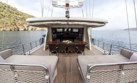 Kayhan 3 yacht deck with sun loungers and open cockpit at sunset