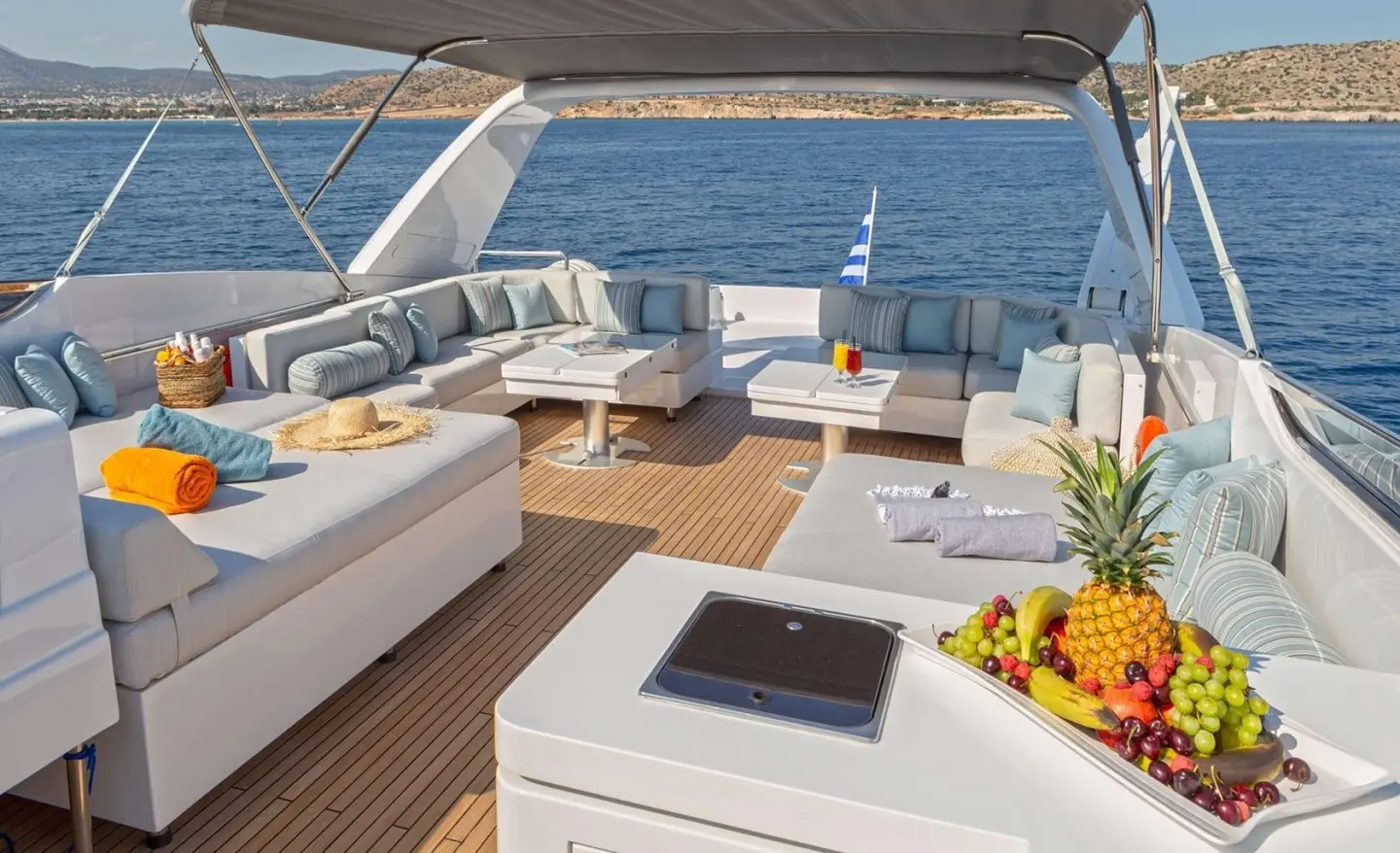 Grace yacht exterior deck with seating, sun loungers, and ocean view