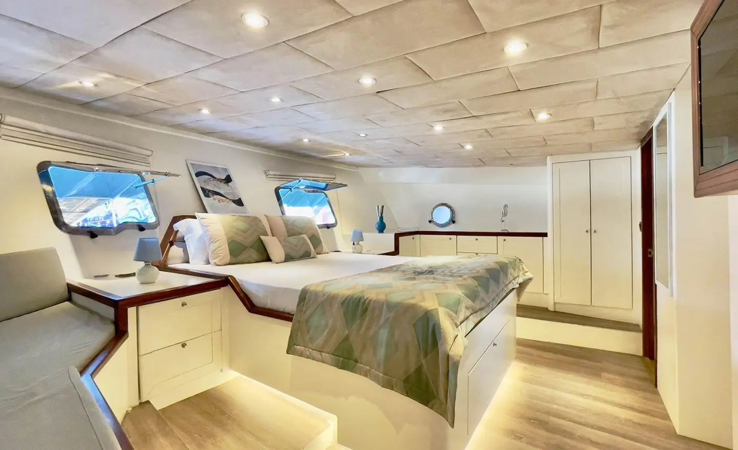 Interior of Derya Deniz gulet master cabin with bed and fitted cabinets