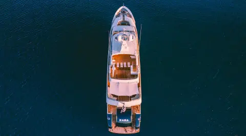 Top-down view of Xana luxury yacht at sea with deck seating and sun loungers
