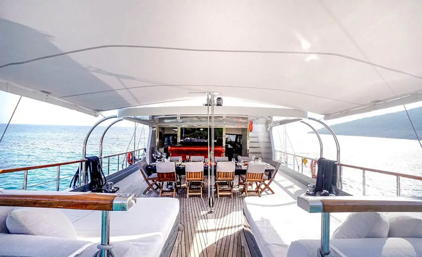 Yacht Virtuoso dining area aboard a luxury gulet at sunset on deck