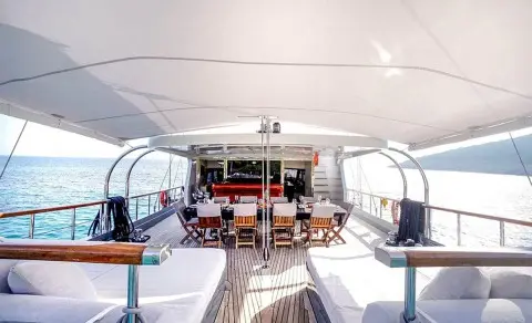 Yacht Virtuoso dining area aboard a luxury gulet at sunset on deck
