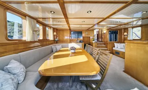 Interior of Morning Star luxury yacht: dining area with long table and seating