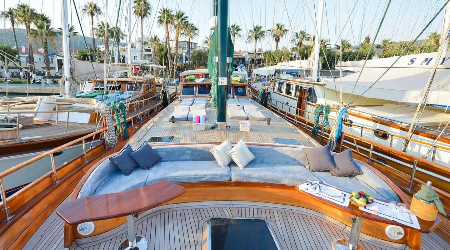 Bow deck of Gulet Ros Mare with sun loungers and shaded seating area