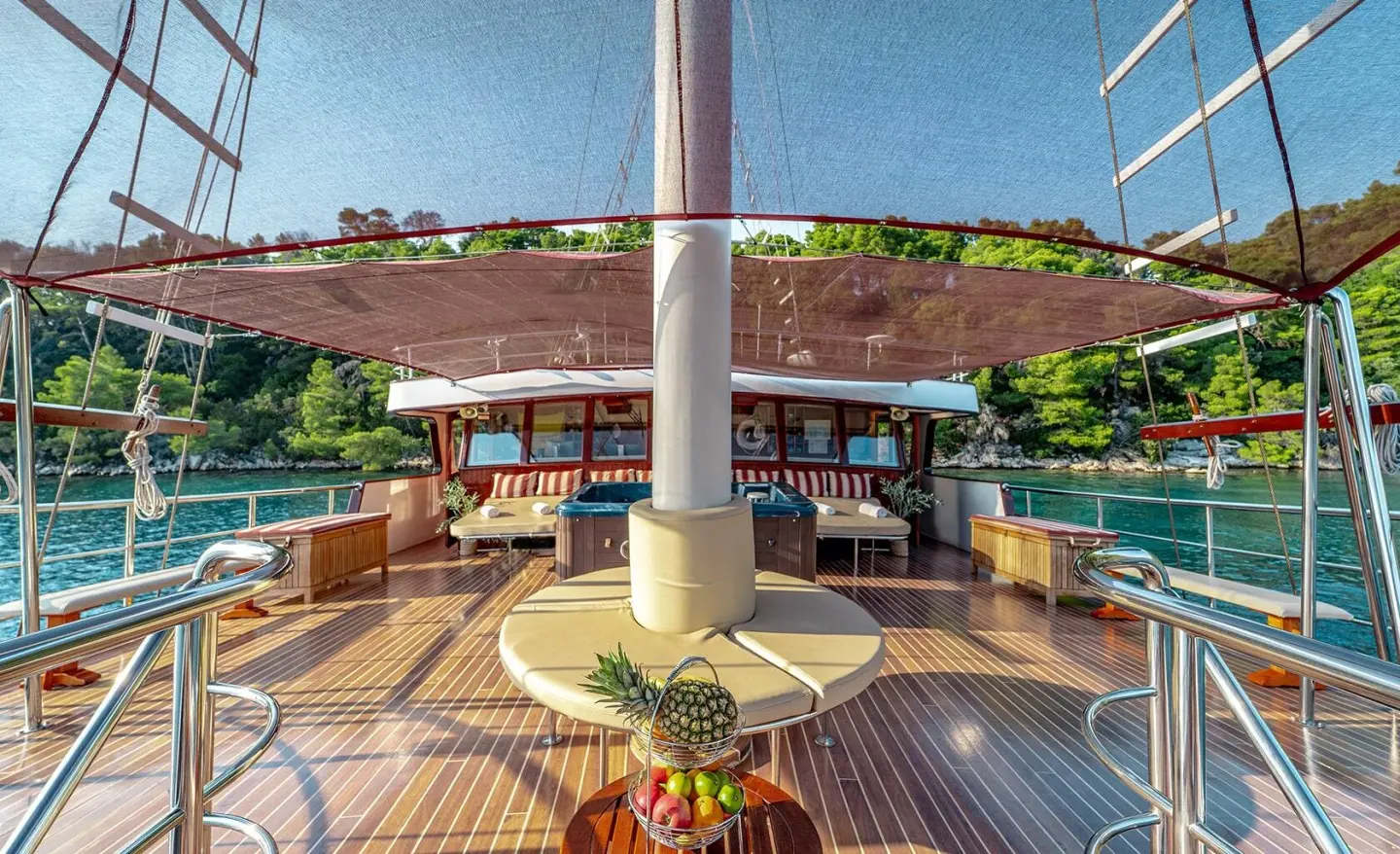 Cesarica luxury gulet yacht deck at sunset with seating and railing