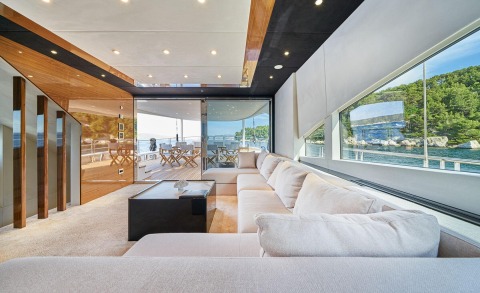 Acapella yacht interior to exterior deck view with sea and greenery