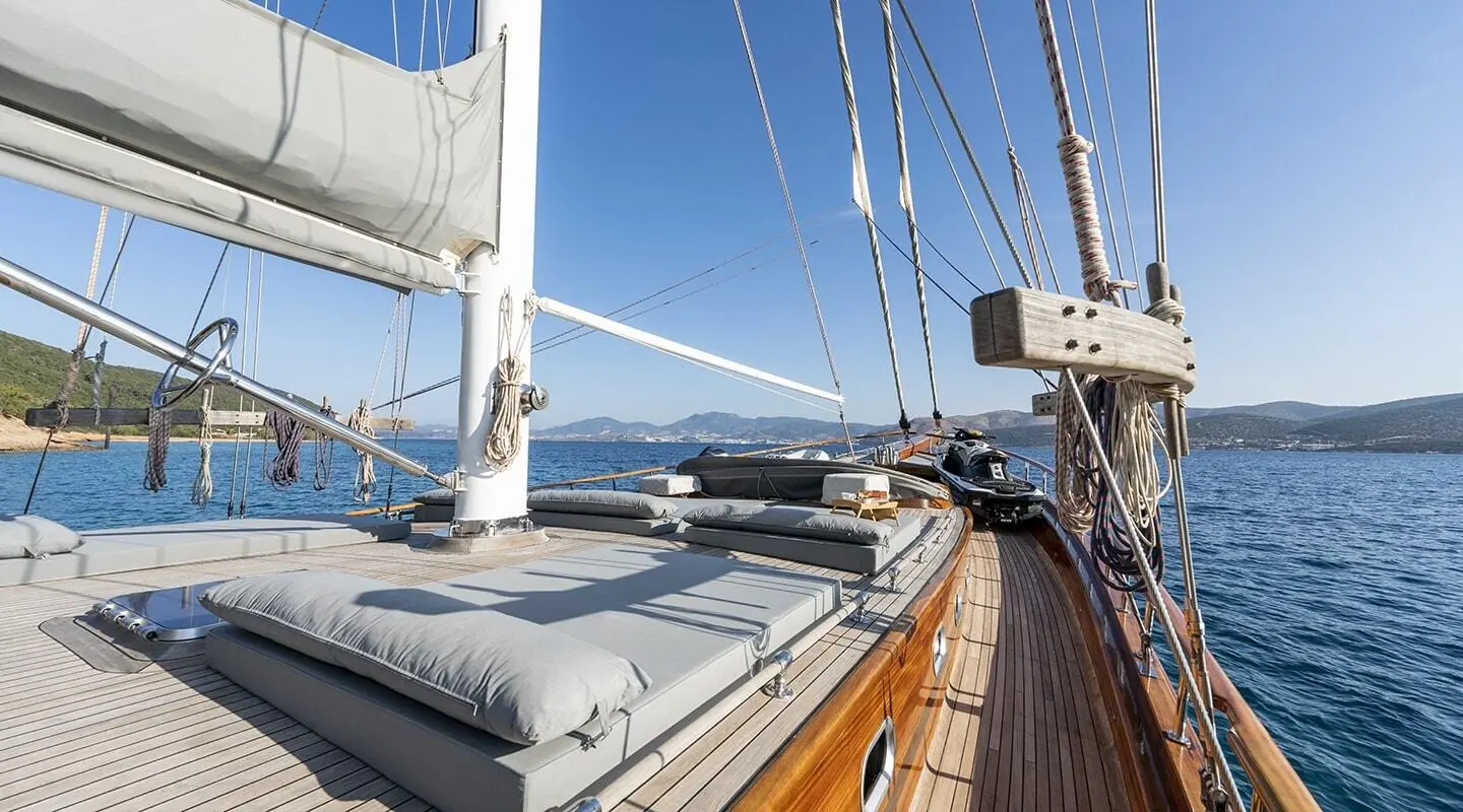 Bedia Sultan luxury yacht deck with sun loungers and open sea backdrop