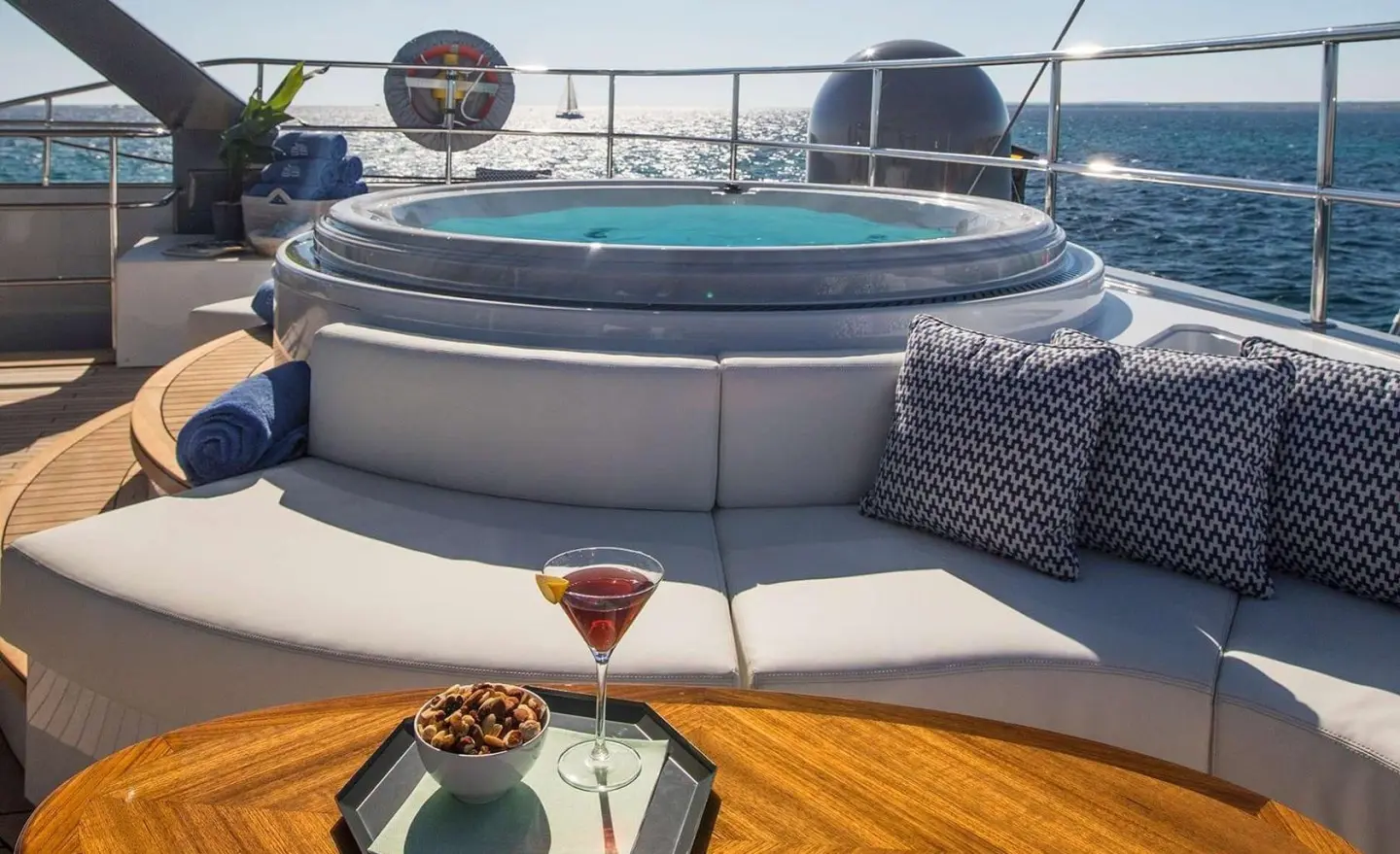 Cartouche yacht on deck with circular jacuzzi and seating area