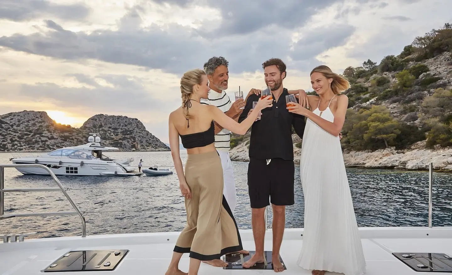 Daiquiri yacht with guests on deck enjoying a wine tasting