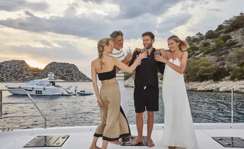 Daiquiri yacht with guests on deck enjoying a wine tasting