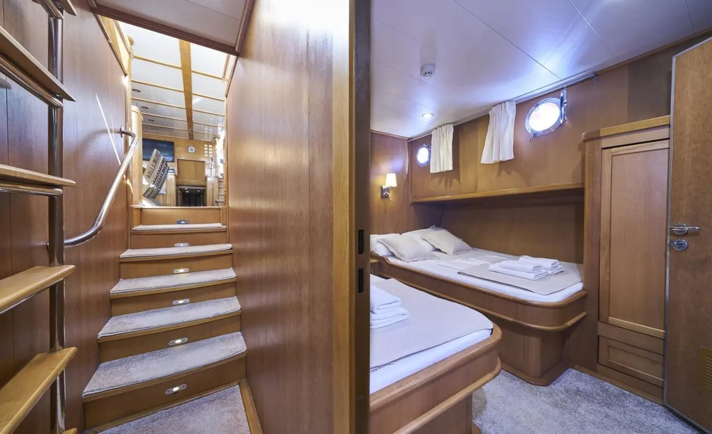 Gulet Morning Star interior with twin cabins, wooden walls and beds visible