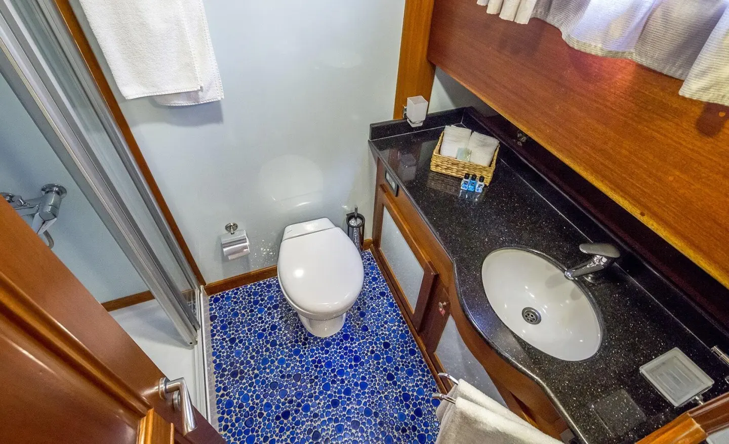 Wooden cabinetry and sink area visible in the cabin