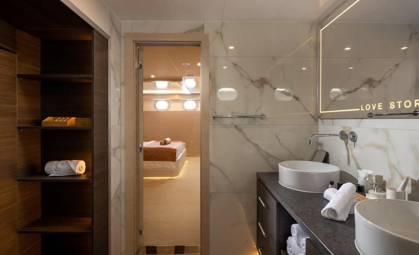 Love Story yacht interior with marble bathroom, sink, and upper cabins.