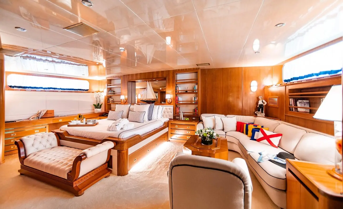 Luxurious interior with a bed, seating area and wooden cabinetry