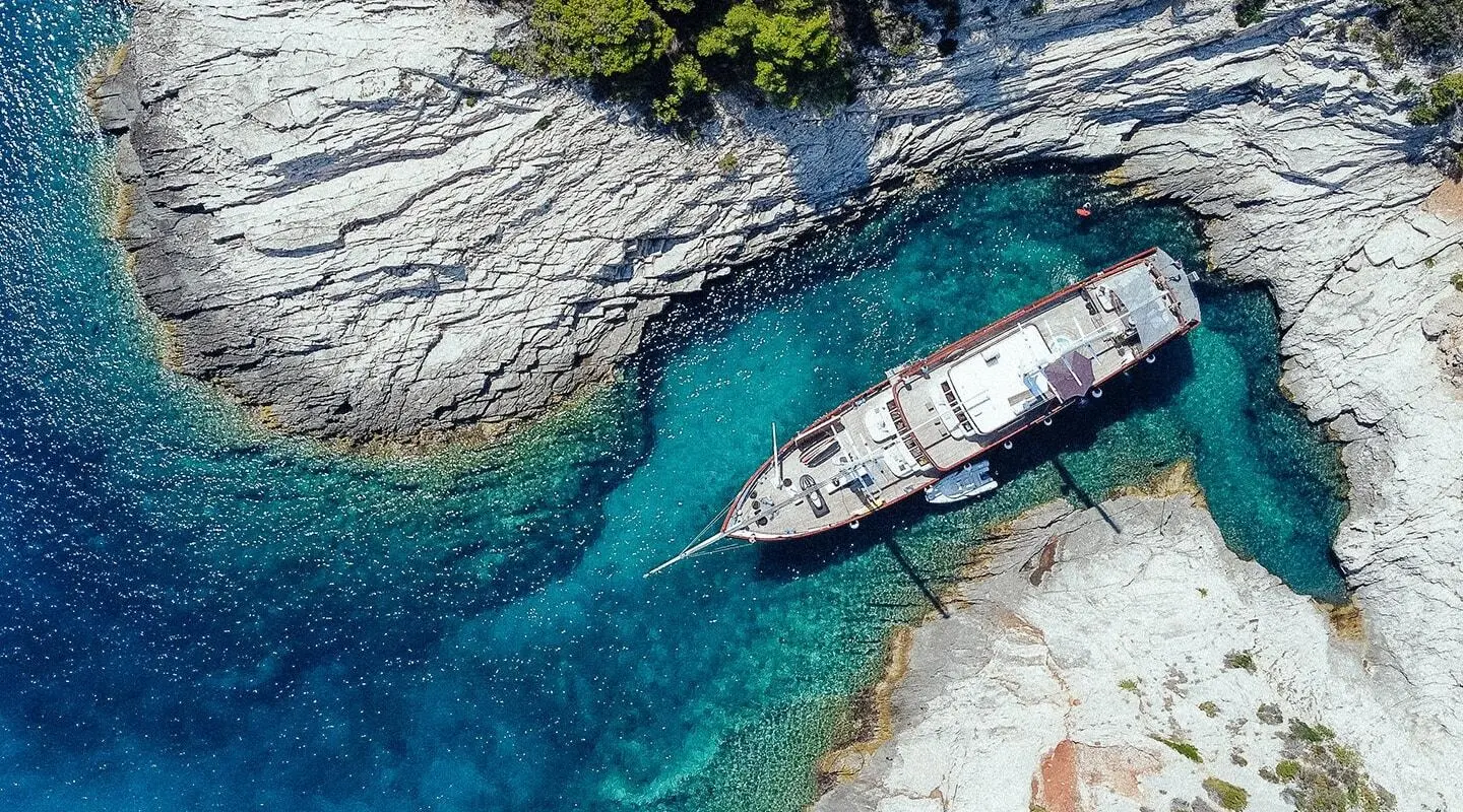 Corsario gulet viewed from above in clear blue waters
