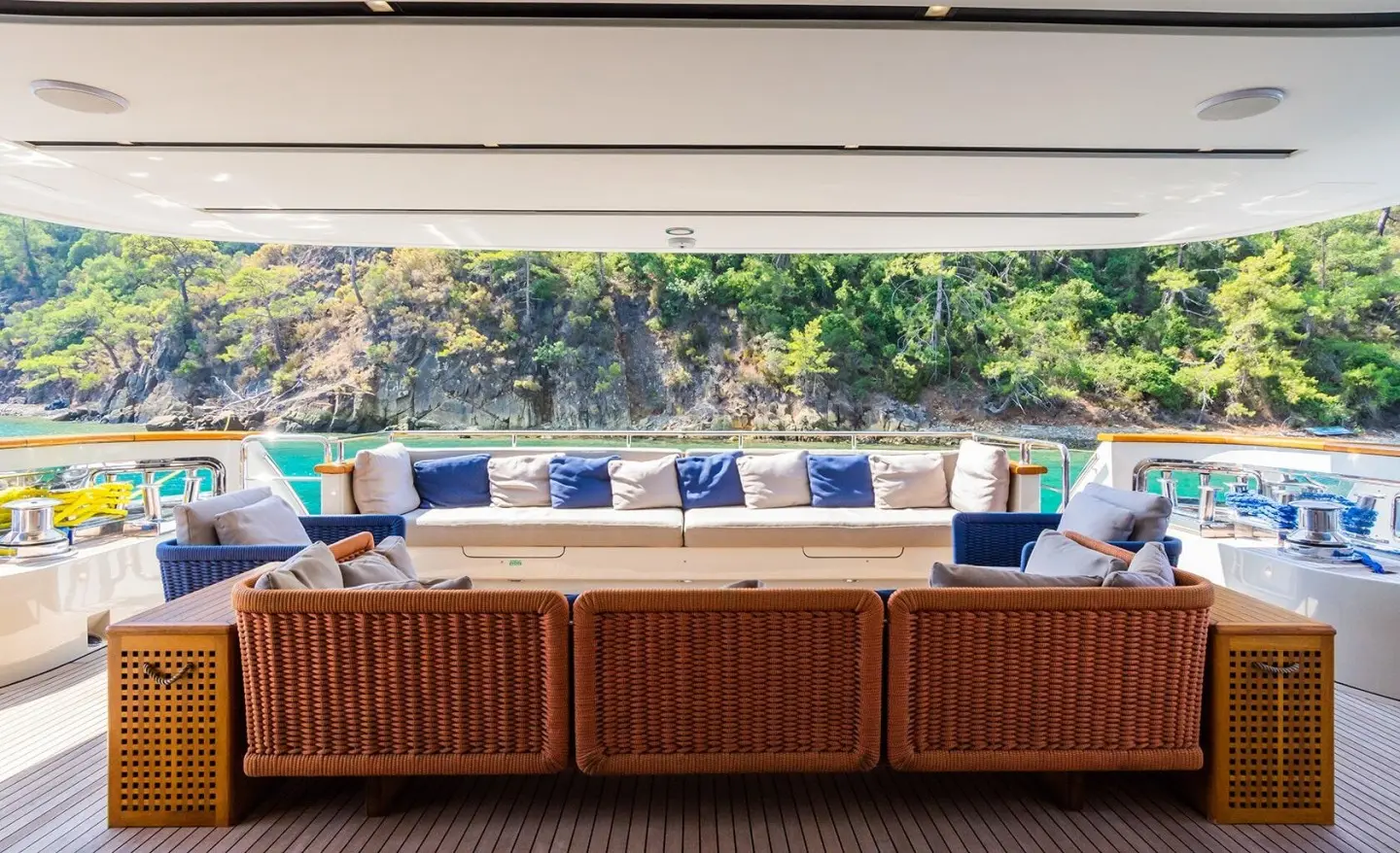 Takara One yacht aft deck seating with white and blue cushions